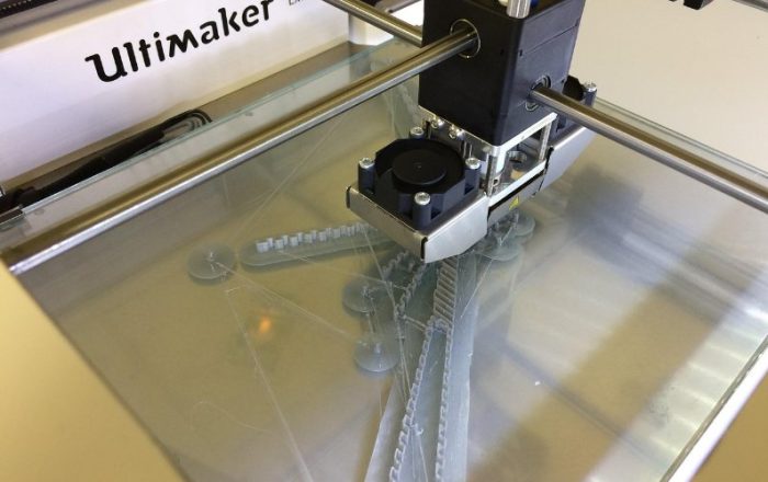 3D printer print head extruding heated filament