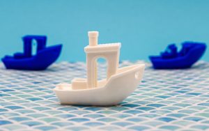 3D printed boats showing curved unsupported surfaces