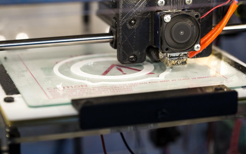 White 3D printed model on a printer build plate