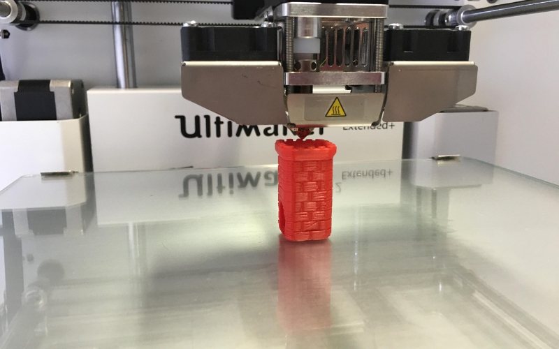 3D print in progress on a heated bed
